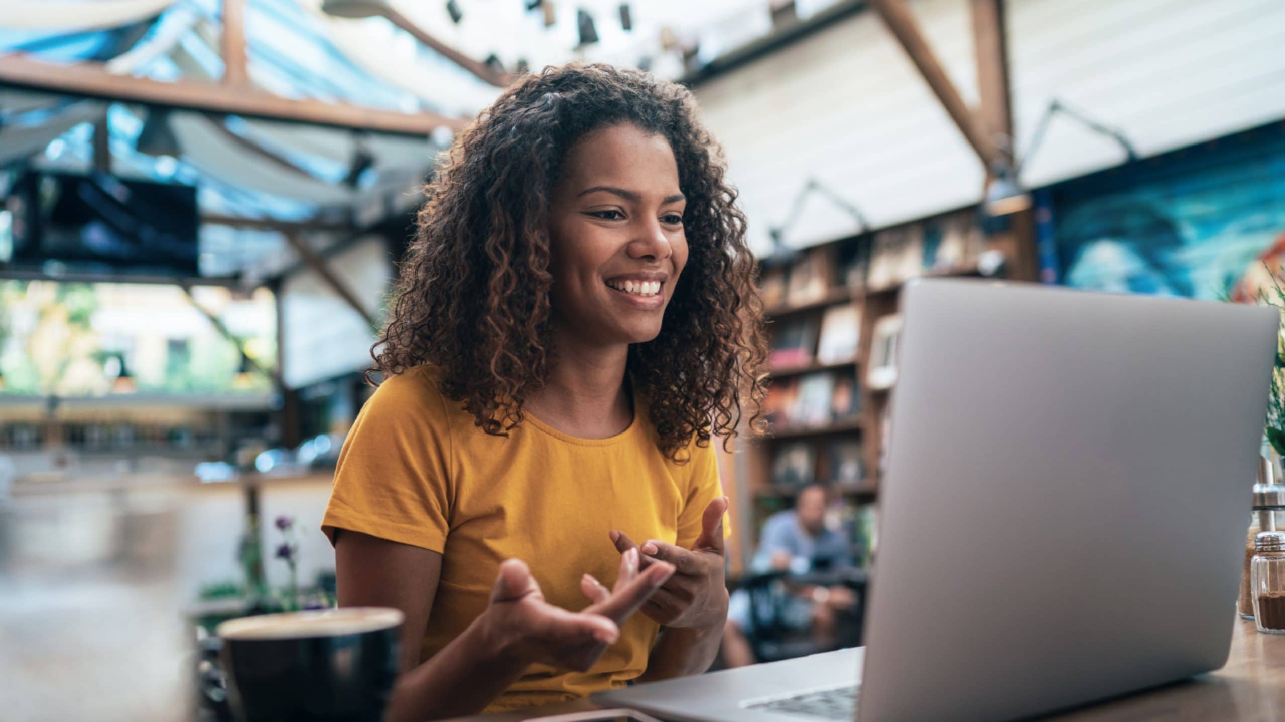 A Woman with Laptop - Talent Trust Compass Group video meeting