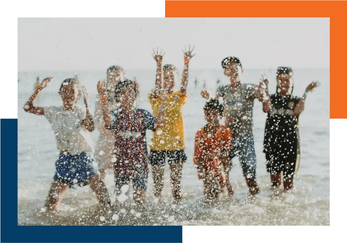 Children having fun by the beach, linked to our Program helping missionaries with their finances