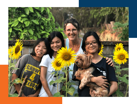 Missionary, kids and sunflowers, linked to Program helping missionaries stay in the field longer