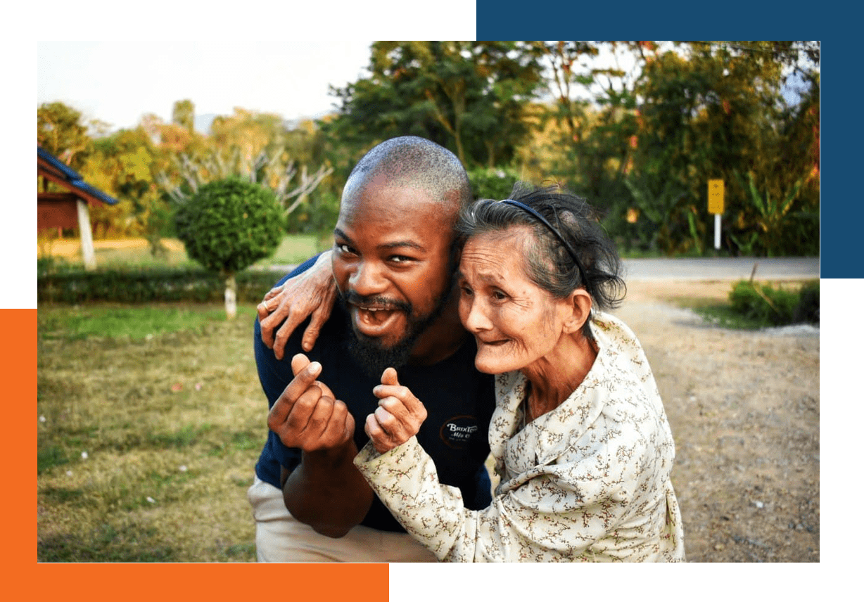 Our international health insurance member hugging a new friend he made while on a mission