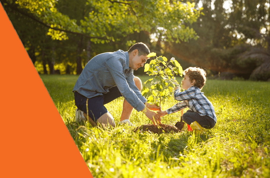 Our private medical insurance policyholder and child planting a tree, linked to our gives back benefit